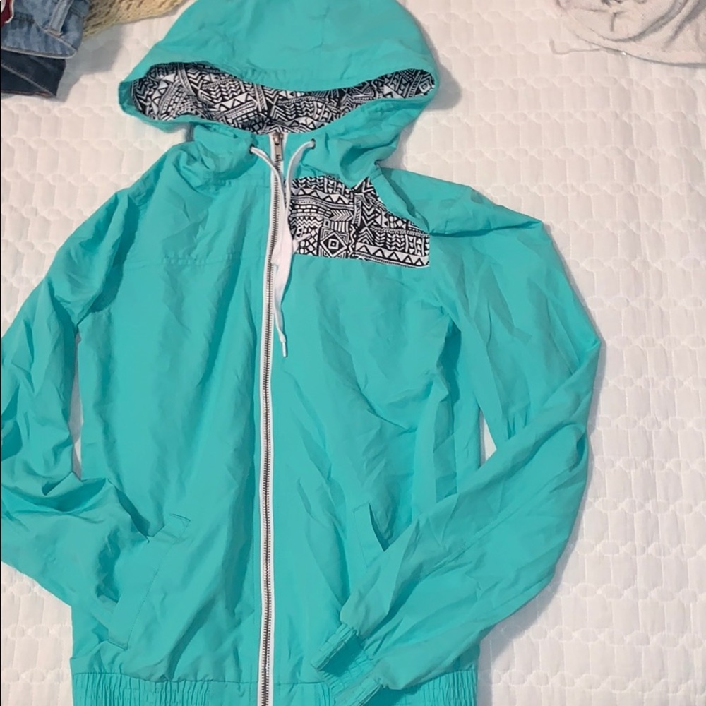 Sea green wind breaker.